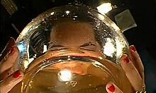 cheerful brunette tests her skills under a wild shower.