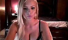 Tempting blonde in lingerie fingers herself on webcam