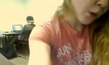 Wavy-haired blonde boldly flashes big natural tits and masturbates in public office webcam show.