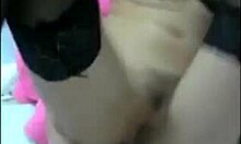 Asian girlfriend explores intimate moments with a large toy in close-up, wearing stockings and glasses.