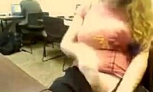 Wavy-haired blonde boldly flashes big natural tits and masturbates in public office webcam show.
