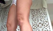 A tanned amateur slowly removes her panties in front of the camera