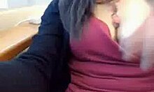 dress-wearing brunette in public office setting