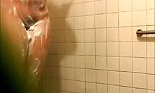 Naked amateur flaunts wet soapy ass in steamy hidden shower clip