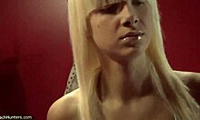 blond-haired beauty with awful bangs showing her small tits and skinny body in voyeur teen scene
