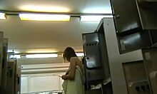 short-haired beauty struts confidently in the locker room, teasing with her miniskirt