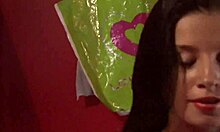 Dark-Haired Beauty Reveals Goodies in Changing Room