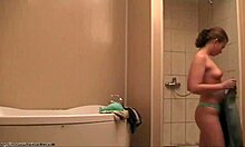 brunette strips naked in the shower