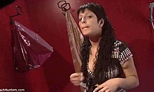 Brunette babe with curly mullet strips solo, flaunting big tits and panties on hidden cam.