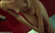 Curly-haired chick strips wet and shows perky tits 😏