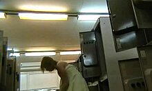 short-haired beauty struts confidently in the locker room, teasing with her miniskirt