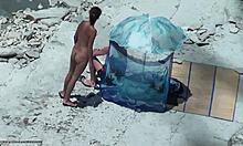 Yo, check this tanned sweaty hottie eating and drinking on beach! 🏖️