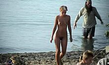 Blond chick flashes her bare pussy on hidden beach camera