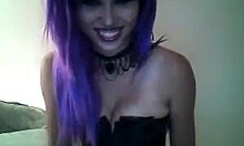 Purple-haired beauty in a corset teasing you on cam