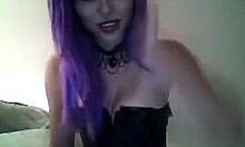 Purple-haired beauty in a corset teasing you on cam