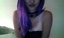 Purple-haired beauty in a corset teasing you on cam