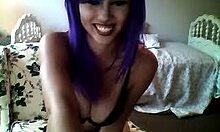 purple-haired camgirl shows playful webcam session