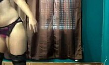 Stockings-clad blond-haired GF sucks on a fake cock