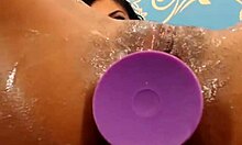 Swarthy hottie slams toy in tight asshole