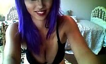 purple-haired camgirl shows playful webcam session
