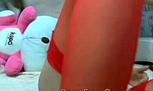 watch this asian brunette in red stockings masturbating with toys on webcam