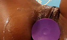 Swarthy hottie slams toy in tight asshole