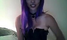Purple-haired beauty in a corset teasing you on cam
