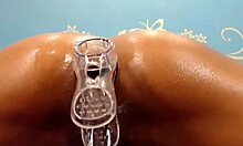 oily body brunette feels intense pleasure riding big fake cock on cam, her long hair swaying as she uses anal beads for deeper masturbation