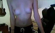 dark-haired camgirl flashes her big tits