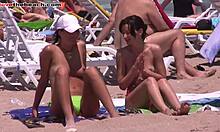 Two Hot Girls Applying Sunscreen on Beach Together in Hidden Cam Scene