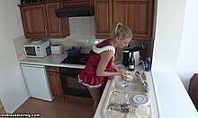 Blonde GF in red get-up does the dishes. She's looking hot with downblouse and panties in HD voyeur holiday fetish