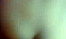 Dark-haired gal holding onto the wall while being fucked doggystyle in front of a mirror