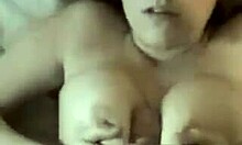 Does this brunette girlfriend use her boobs to jack off her partner?