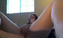 Sleepy redhead in pigtails vibrates her pussy on bed