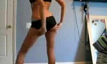 Slender blondie poses proudly in black lingerie