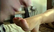 curvy amateur gf barefoot on bed, playing with her big tits and feet fetish style