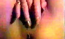 girl with red nails fingers her unshaved pink pussy