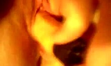 Horny slut inserts large toy into shaved pussy during solo close-up