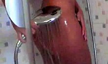 brunette in shower shows off her curves