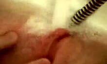 is this slut in the bath touching her shaved pussy while thinking about porn?