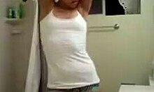 a petite latina undresses and dances in the bathroom for webcam