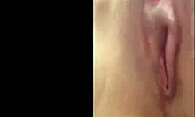 Hey, watch this attractive hottie playing with her trimmed pussy!