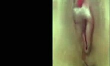 Hey, watch this attractive hottie playing with her trimmed pussy!