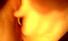 Horny slut inserts large toy into shaved pussy during solo close-up