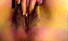 girl with red nails fingers her unshaved pink pussy