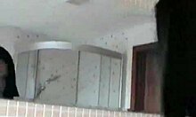 brunette in shower shows off her curves