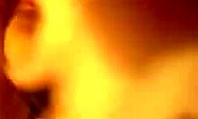 Horny slut inserts large toy into shaved pussy during solo close-up