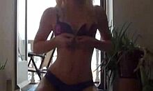 blonde babe strips down, flashes shaved pussy and ass