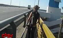 Exotic woman in sunglasses performs in car