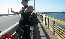 Exotic woman in sunglasses performs in car